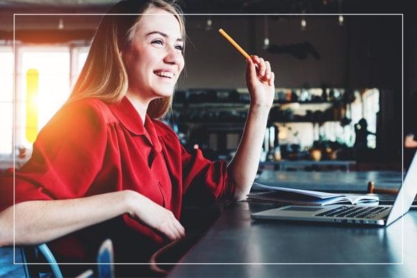 Smiling woman working on her laptop